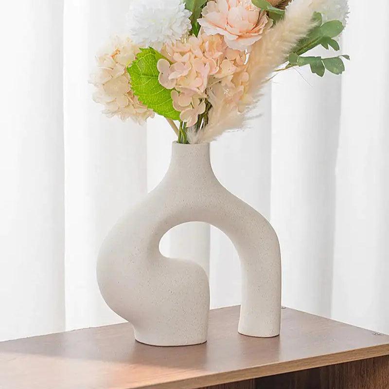 Abstract double ceramic vase on a shelf, home decor inspiration
