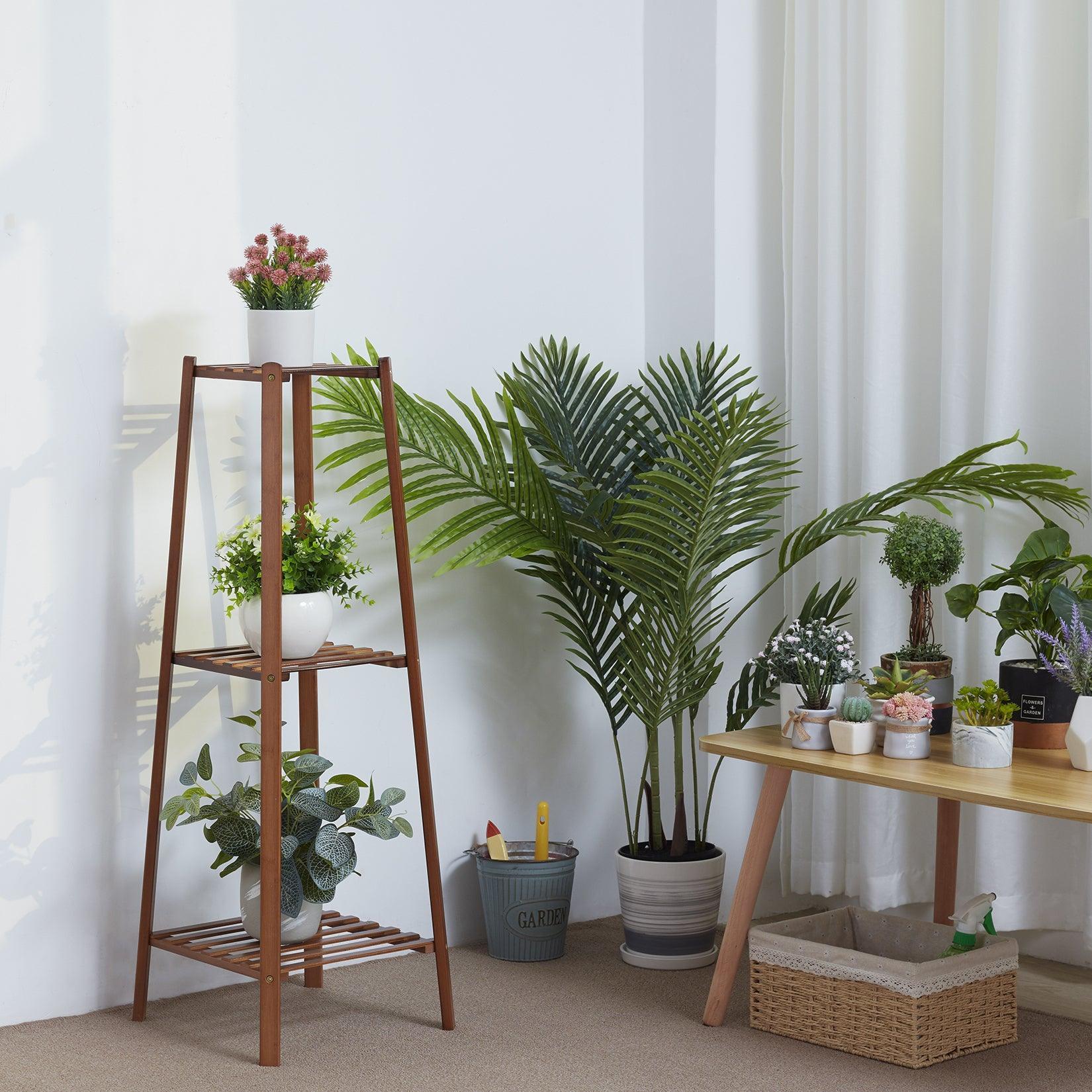 Multi-tiered bamboo plant stand for indoor and outdoor decoration.