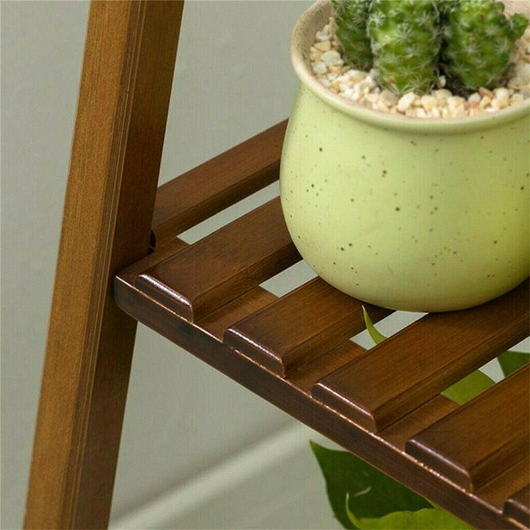 Indoor and outdoor bamboo plant stand with multiple storage tiers.