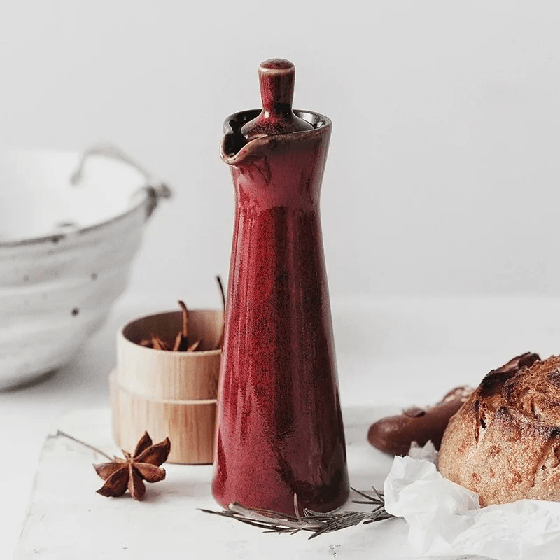 Oil and vinegar dispenser bottle made from ceramic with run glaze finish