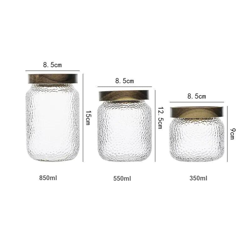 Airtight glass storage jar with wooden lid and decorative design