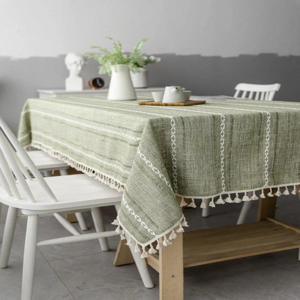Close-up of a stylish architectural sage linen tablecloth