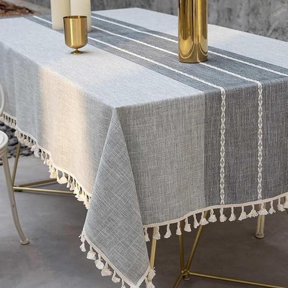 Faded, fringed linen table runner with a distressed finish
