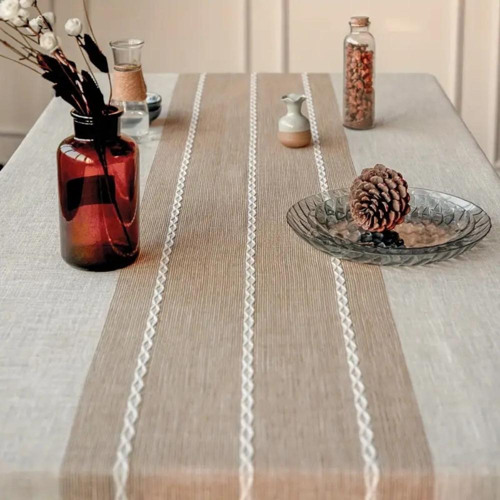 Vintage-inspired linen table runner with a fringed edge