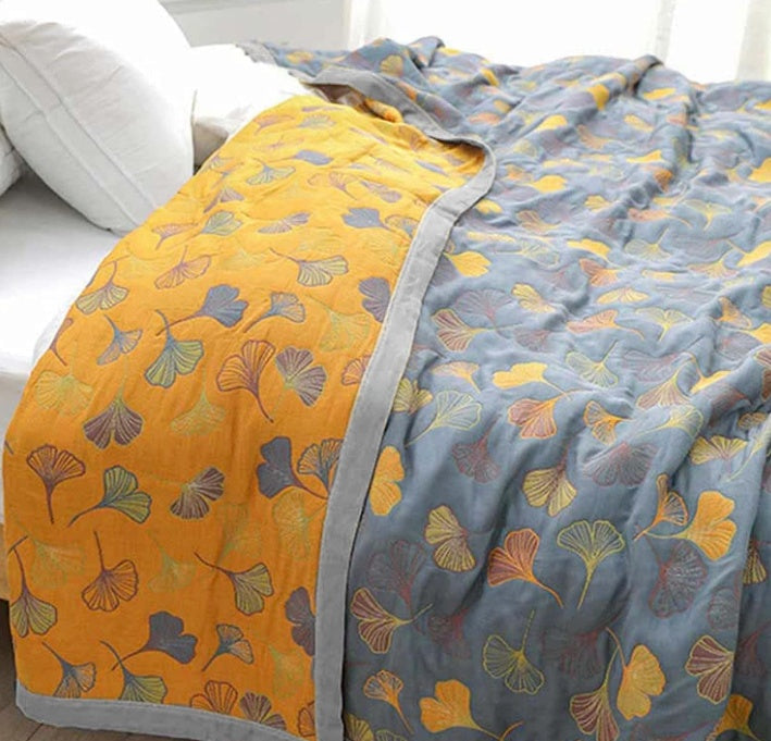 Luxury Elara Haus reversible cotton throw featuring beautiful ginkgo leaf design and high-quality materials