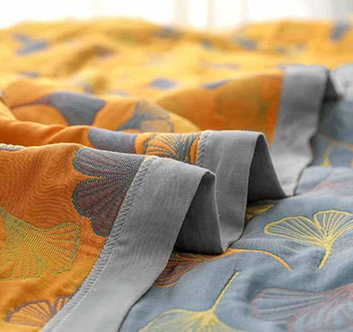 Sophisticated Elara Haus reversible cotton throw with unique ginkgo leaf pattern for added style