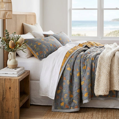 Elegant Elara Haus reversible cotton throw featuring a natural ginkgo leaf design