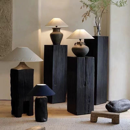 Display pedestal made from solid charcoaled wood for home decor, sculptures or plants