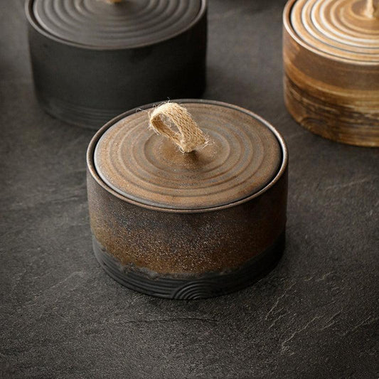 Wabi-Sabi inspired hemp rope storage jar with kintsugi model Japanese pottery design