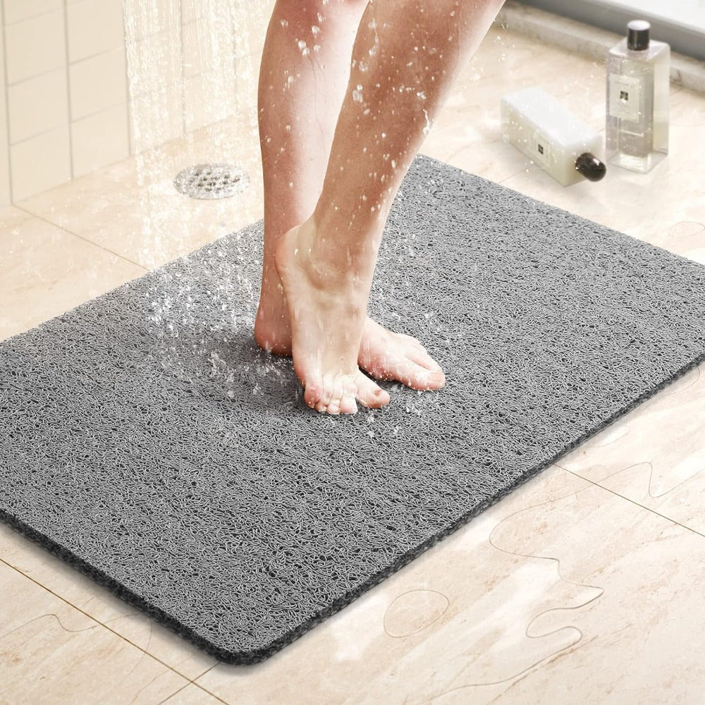 Textured loofah-style shower mat for comfort and stability
