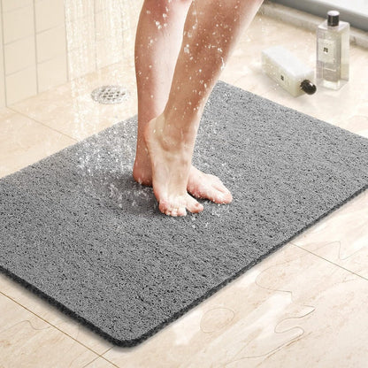 Textured loofah-style shower mat for comfort and stability